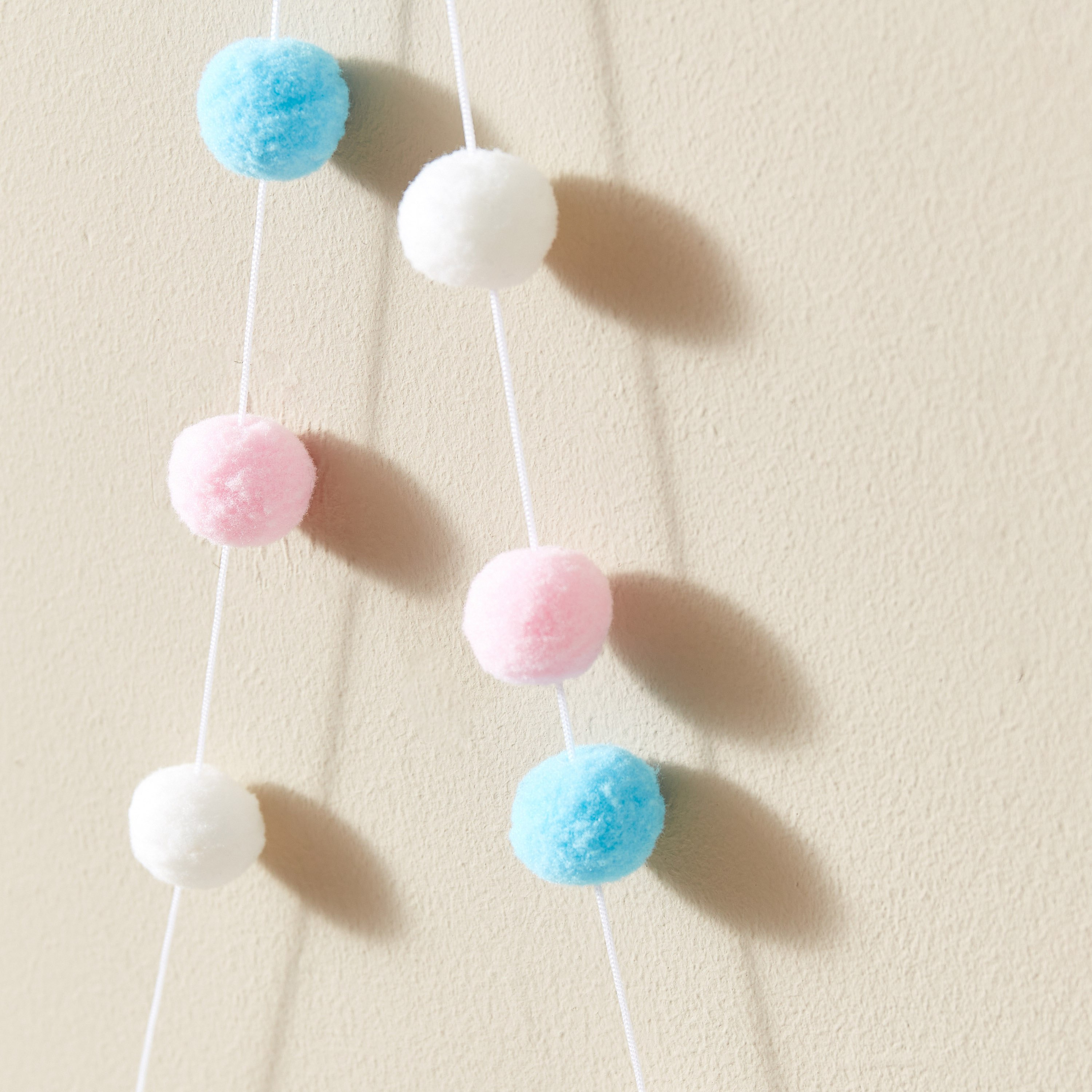 Hanging pom poms for hot sale nursery