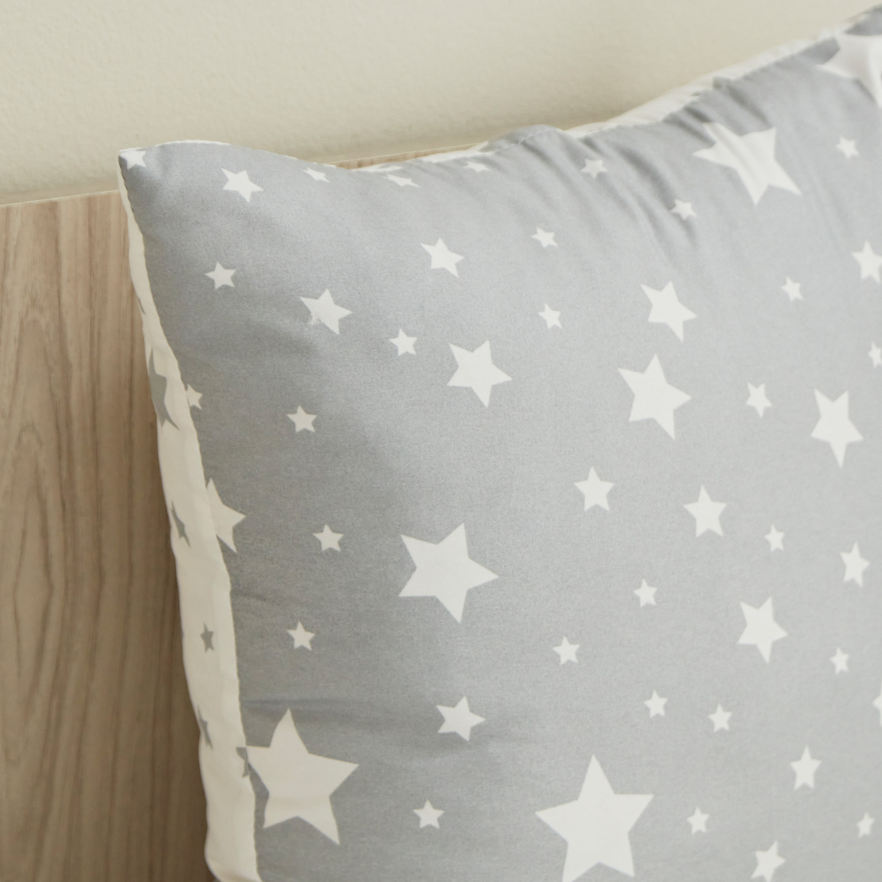 Grey and store white star cushion