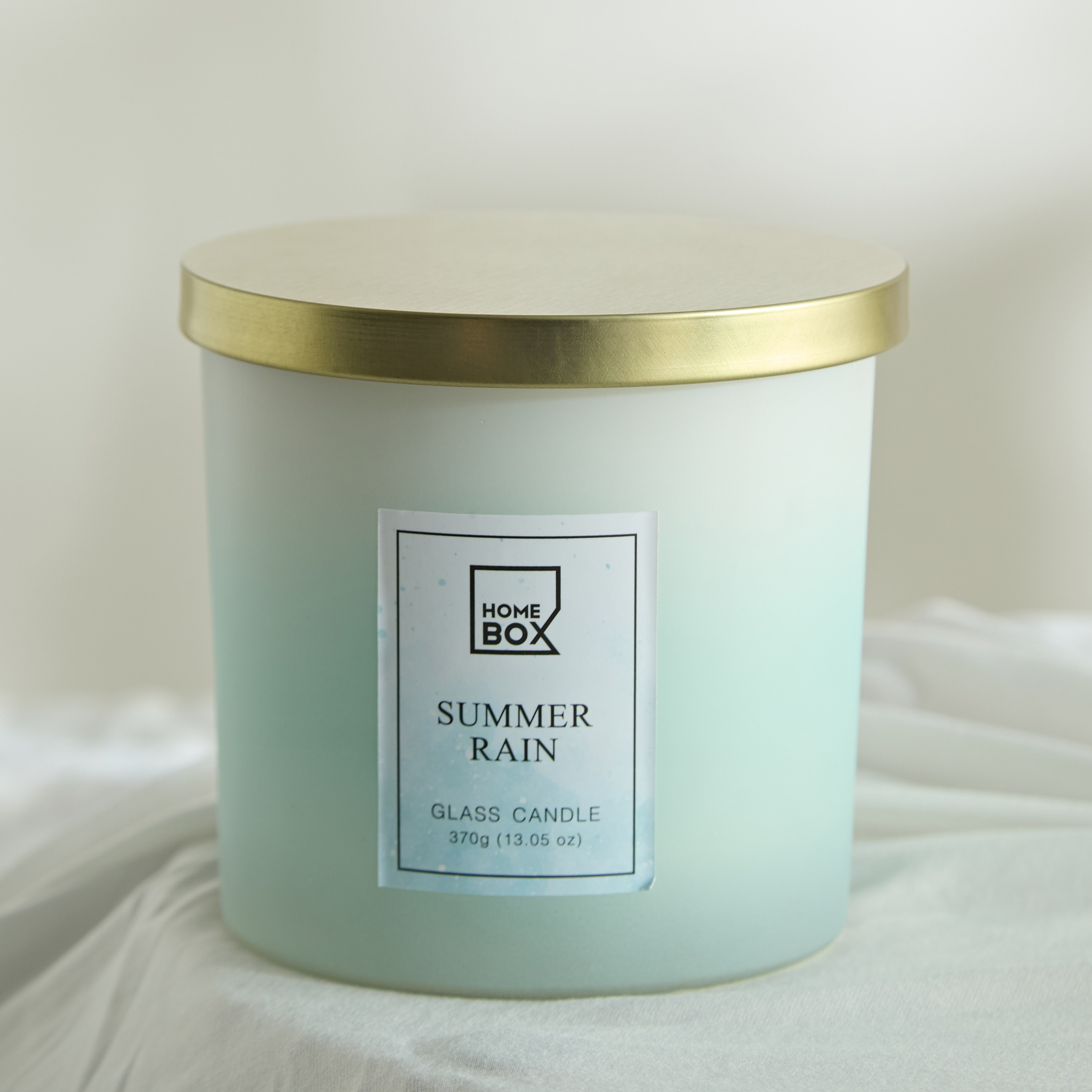 شمعة بغطاء معدني سمر رين من جاردن - 380 جم-hbxlivingroom-decorandaccessories-candles-image-1